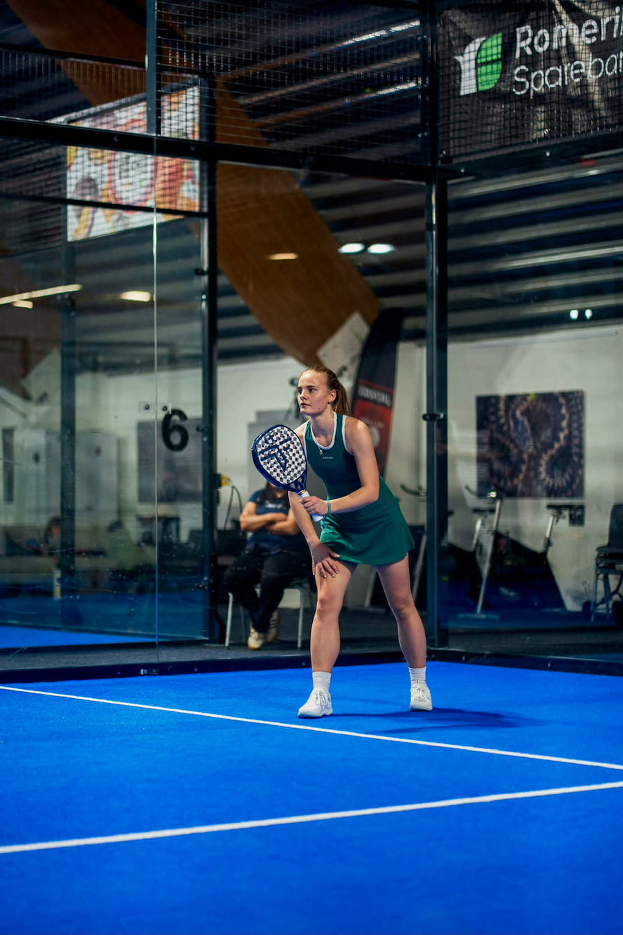 Woman playing padel in Dessard