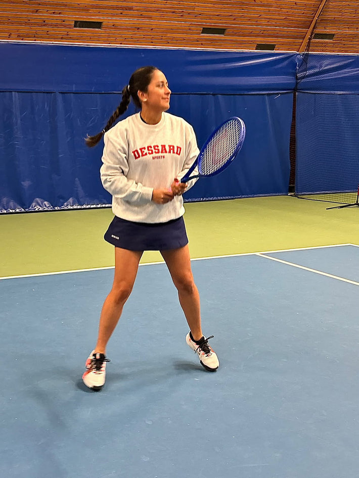 Susana Hernandez Krohn playing tennis in Dessard